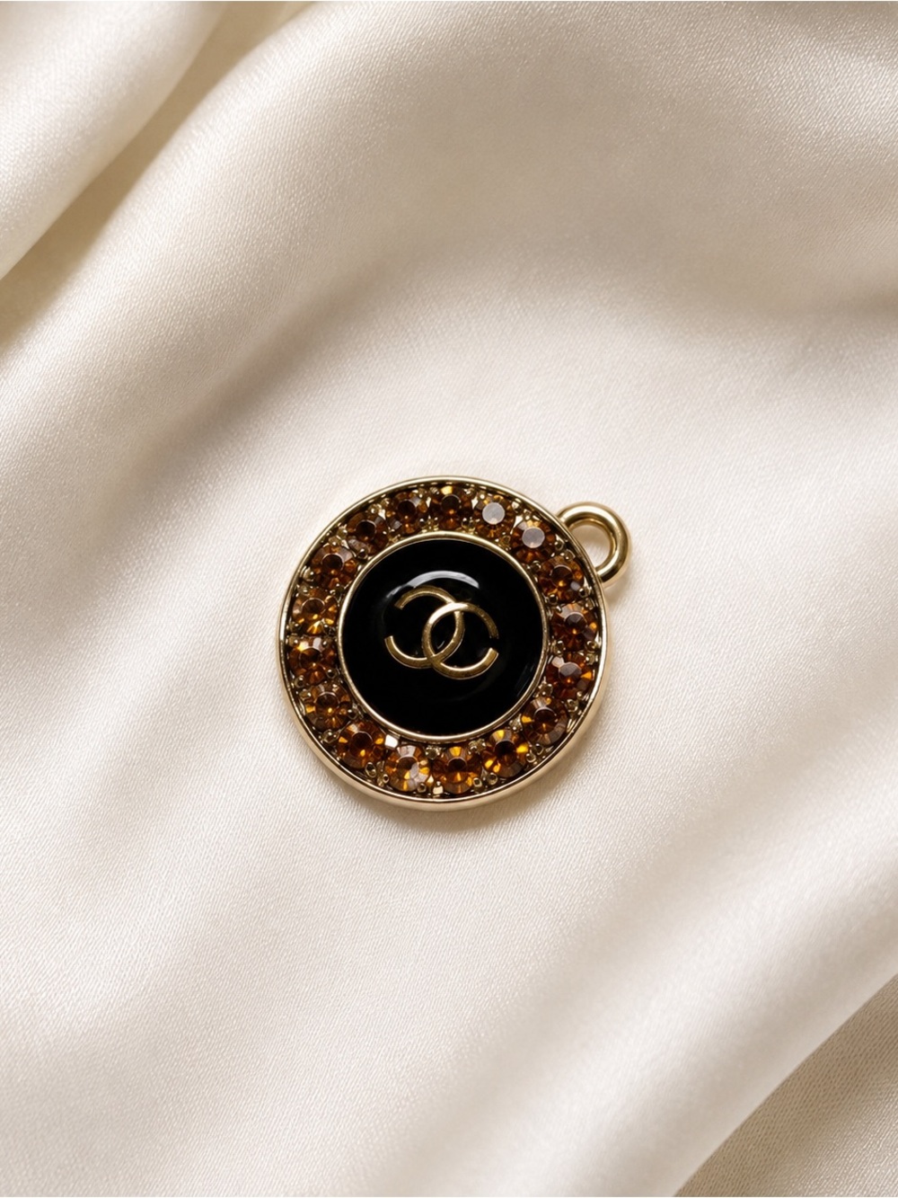 CHANEL Gold-Tone Black Enamel CC Charm with Brown Crystal Halo